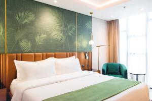 A bed or beds in a room at Ironwood Hotel