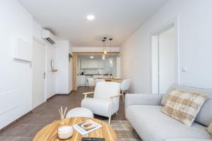 a living room with a couch and a table at Milenial Immo VT3-2 Figueres Dalí Museum and Rambla in Figueres