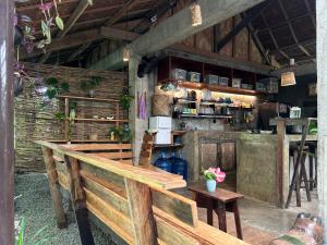 a kitchen with a counter and a table in a room at LOA Stay in Surigao