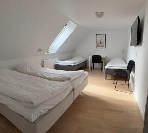 Postel nebo postele na pokoji v ubytování Guesthouse Hune