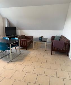 TV a/nebo společenská místnost v ubytování Guesthouse Hune
