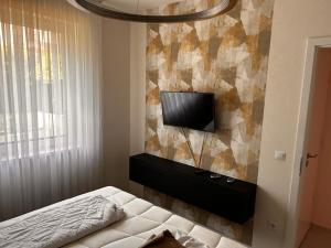 Ένα ή περισσότερα κρεβάτια σε δωμάτιο στο Oasis Lux