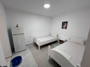 Postel nebo postele na pokoji v ubytování Guest House Vlore