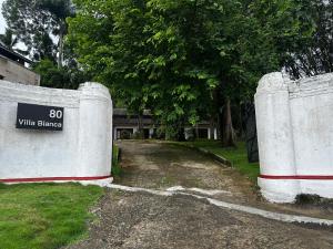 a building with a sign that says wildlife fence at Villa Bianca in Kegalle