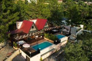 an aerial view of a house with a swimming pool at Sapolto Villas Faralya in Fethiye