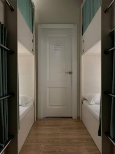 Postel nebo postele na pokoji v ubytování Hostel Nomad