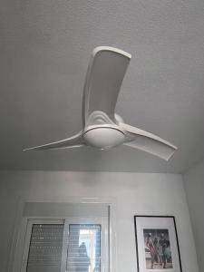 a white ceiling fan is hanging from a ceiling at 1-Bed Apt 10 mins to Beach Choose from 4 Pools in San Miguel de Salinas