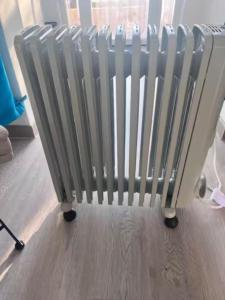 a radiator sitting on the floor in a room at 1-Bed Apt 10 mins to Beach Choose from 4 Pools in San Miguel de Salinas
