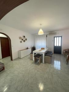 a large living room with a white table and chairs at Casa da Aldeia in Moura