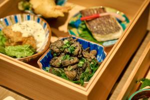 a table with two plates of food on it at Territory25 in Miyazaki