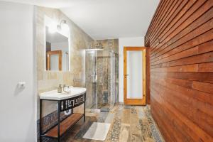 a bathroom with a sink and a shower at Casa Galand in Pîrscov +75 photos