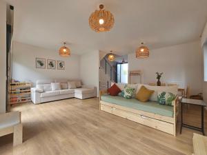 a living room with a couch and a table at L'adagio Olimpico by ARoom VUT-LE-1361 in León