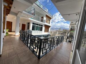 a balcony of a house with a view at Highway Inn Guest House in Leh