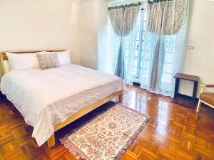 Katil atau katil-katil dalam bilik di Little Courtyard Inn