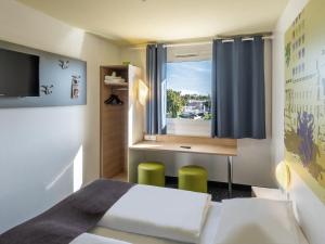 Postel nebo postele na pokoji v ubytování B&B Hotel Braunschweig-Nord