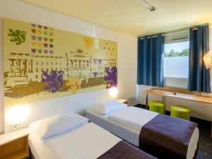 Postel nebo postele na pokoji v ubytování B&B Hotel Braunschweig-Nord