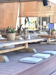 a table with pillows on top of a patio at SeaTerra Boutique suite in Kalamos +41 photos