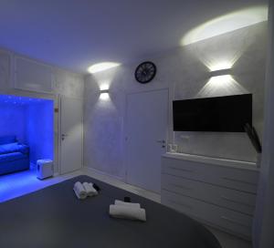 Televízia a/alebo spoločenská miestnosť v ubytovaní Sogno in via Dante 336