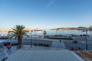 a view of a parking lot next to a body of water at Casita in Ermoupoli