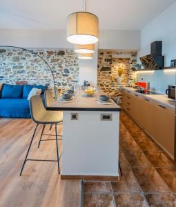 a kitchen and living room with a table and chairs at Casita in Ermoupoli