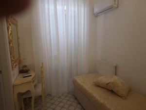 Cama ou camas em um quarto em Hotel La Perla