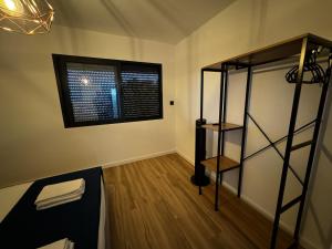 a room with a bunk bed and a window at Sky & Ocean in Calheta
