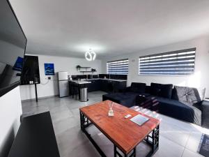 a living room with a couch and a table at The Lantern Luxe Retreat in Johannesburg +12 photos