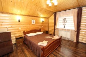 Postel nebo postele na pokoji v ubytování Ластівчине гніздо