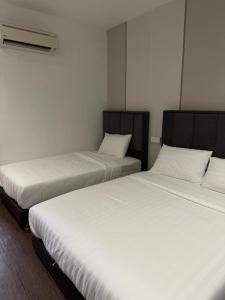 Winn's Hotel Bentong客房内的一张或多张床位