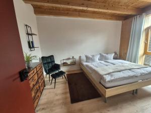 a bedroom with a bed and a desk and a chair at Enkelburg in Saal +14 photos
