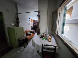 a living room with a table and a couch and a window at Fatma's aparthotel in Cairo
