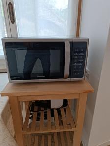 TV a/nebo společenská místnost v ubytování Studio Zu - Lakeside Apartment