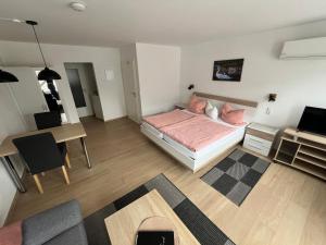 Postel nebo postele na pokoji v ubytování Ferienwohnungen und Appartements - Haus Budinger