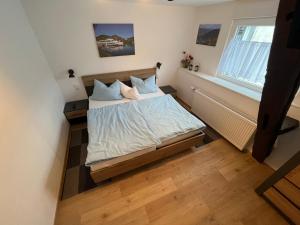 Postel nebo postele na pokoji v ubytování Ferienwohnungen und Appartements - Haus Budinger