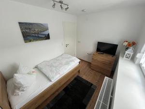 Postel nebo postele na pokoji v ubytování Ferienwohnungen und Appartements - Haus Budinger