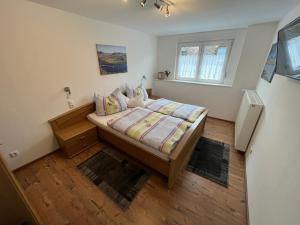 Postel nebo postele na pokoji v ubytování Ferienwohnungen und Appartements - Haus Budinger