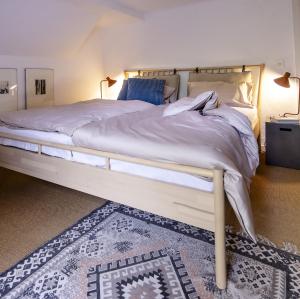 En eller flere senge i et værelse på Wohnung im Grünen cottage33