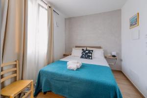Postel nebo postele na pokoji v ubytování Franciacorta Rooms 1