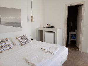 Postel nebo postele na pokoji v ubytování Central Emporio Rooms + 5 fotografií
