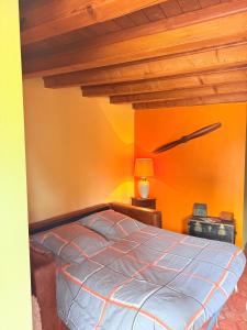 a bedroom with a bed and a wooden ceiling at Chambre La Dracysienne in Dracy-le-Fort