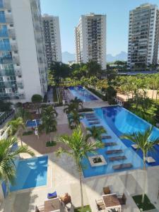 an aerial view of the pool at a resort at Studio Ilha Pura Barra Olímpica in Rio de Janeiro