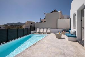 a swimming pool on the balcony of a house at White Orchid Suites in Vóthon