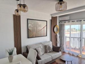 A seating area at Apartamento Primera Línea de Playa Paseo Marítimo Perla 5