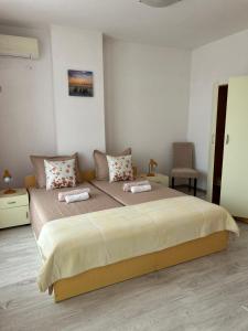A bed or beds in a room at Guest House Pomorie