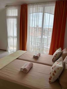 A bed or beds in a room at Guest House Pomorie
