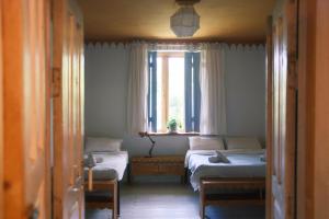 Ένα ή περισσότερα κρεβάτια σε δωμάτιο στο Karma Hostel
