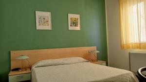 Postel nebo postele na pokoji v ubytování Hotel Ariston Imperial