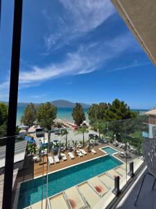 a view from the balcony of a resort with a swimming pool at Orik Hotel & Spa in Vlorë +46 photos