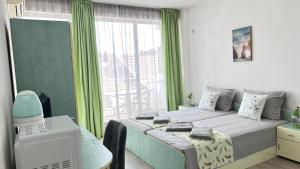A bed or beds in a room at Guest House Pomorie