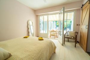 Giường trong phòng chung tại Design, coeur d'Arcachon et plage à pied